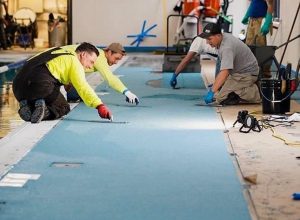 Asheville YMCA Pool Deck - Epoxy HDQ-100 color quartz mortar handtrowel2 - High Tech Solutions TN